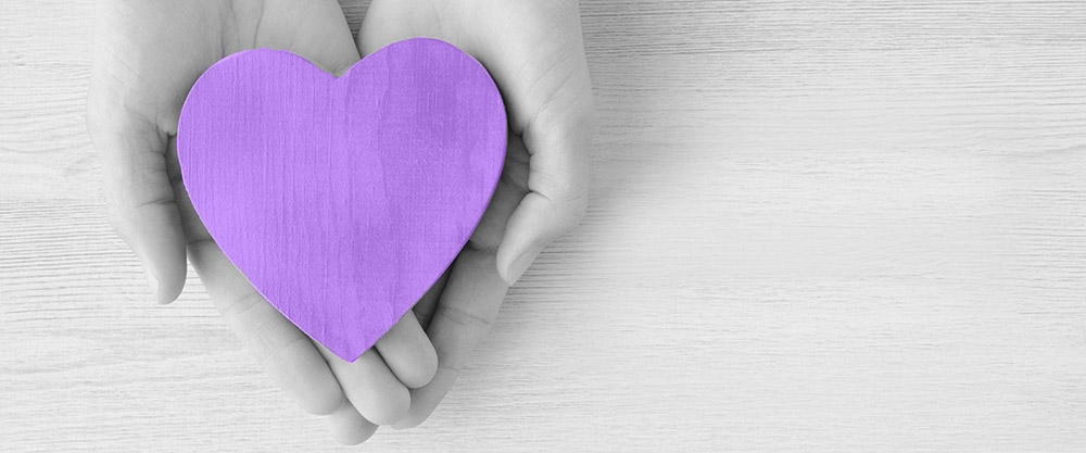 graphic of hands holding a heart