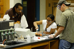 Students work together on chemistry experiment.