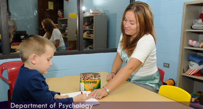 School psychology student working with client.