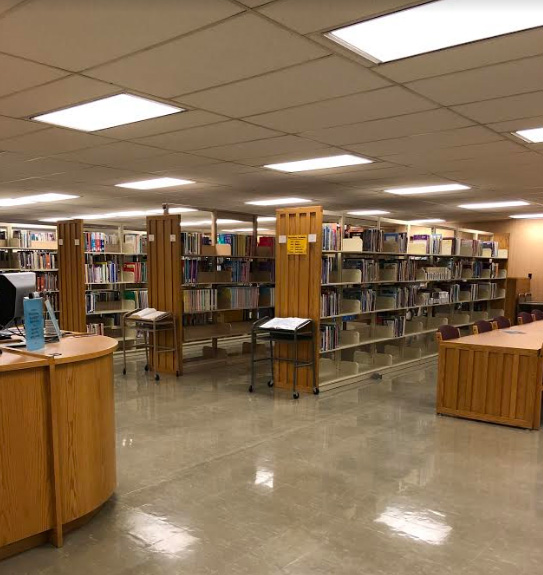 photo of tables and shelves of books