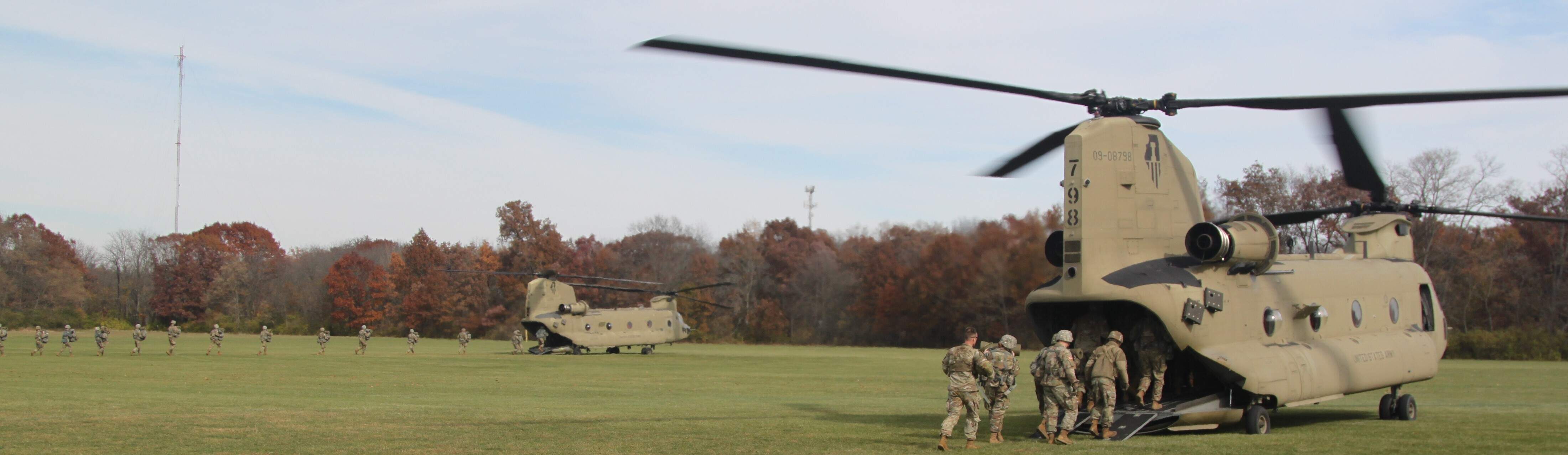 Cadets entering CH-47 Chinook at Vince Grady Field