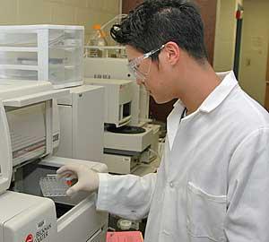 Chemistry student conducting experiment.