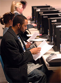Student studying in computer lab.