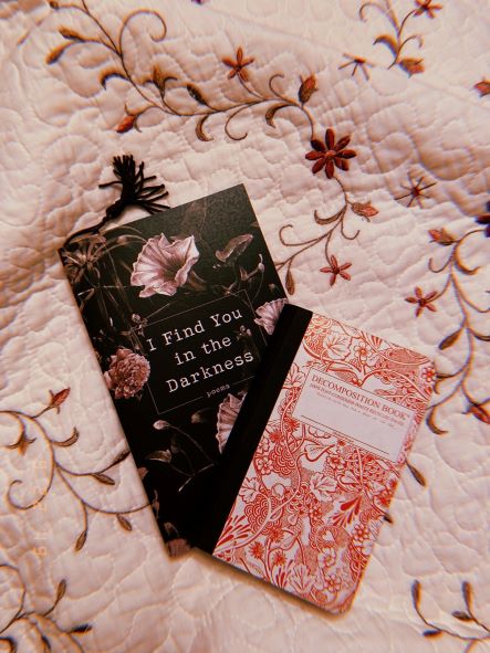 Two books on a floral bedspread