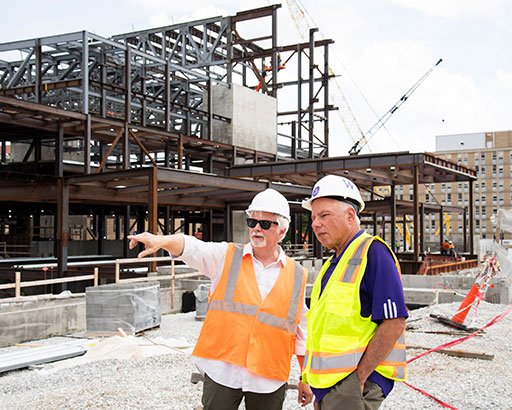 Billy Clow and former WIU President Al Goldfarb standing in front of the CPA (under construction)