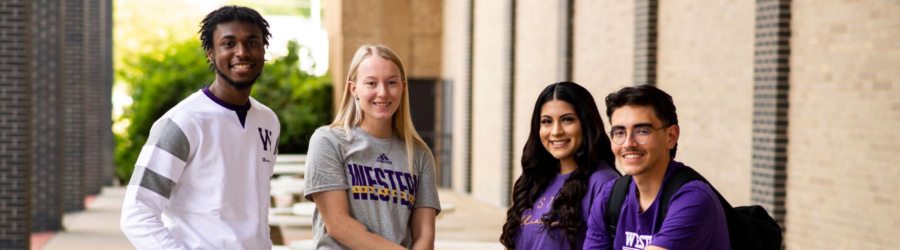 students wearing WIU apparel