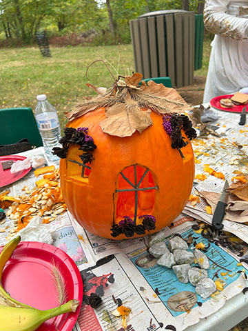 a decorated pumpkin carved with windows