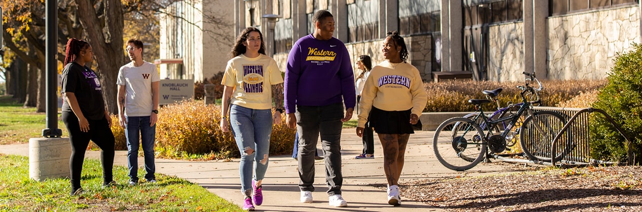 students on campus during the fall season