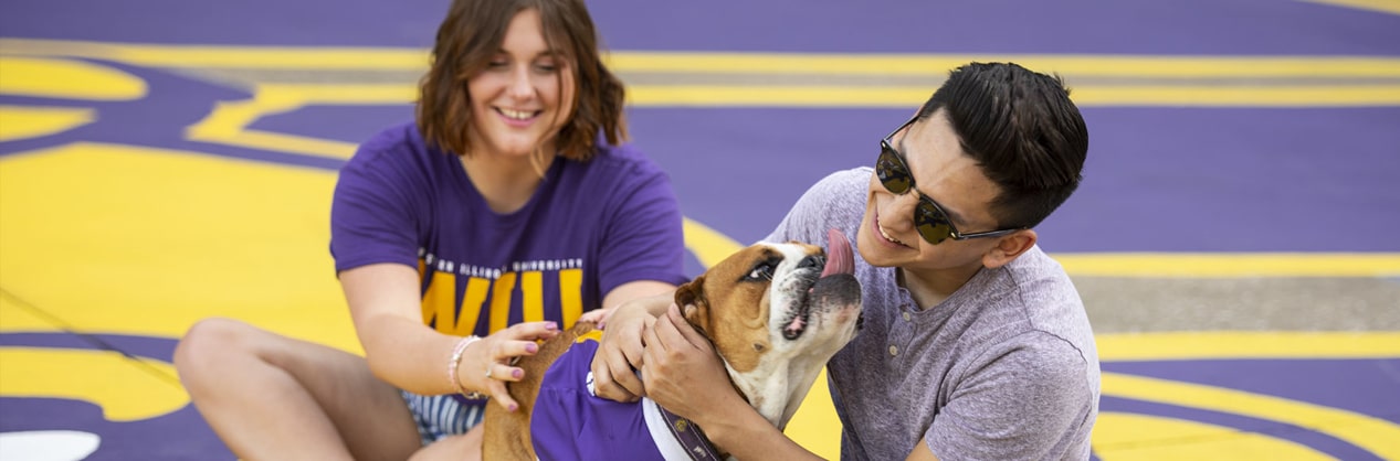 students getting licked by WIU mascot Col. Rock IV