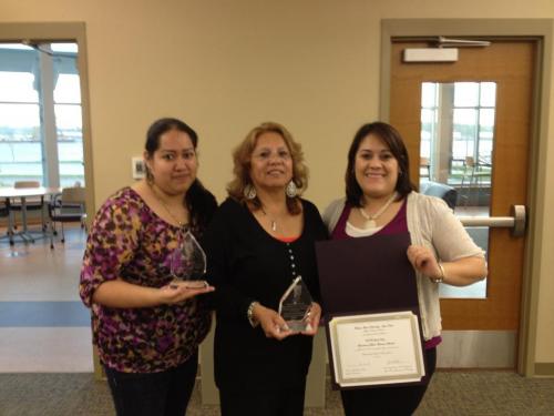 Treviño stands with peers after winning the WIU-QC Student of the Year award. 